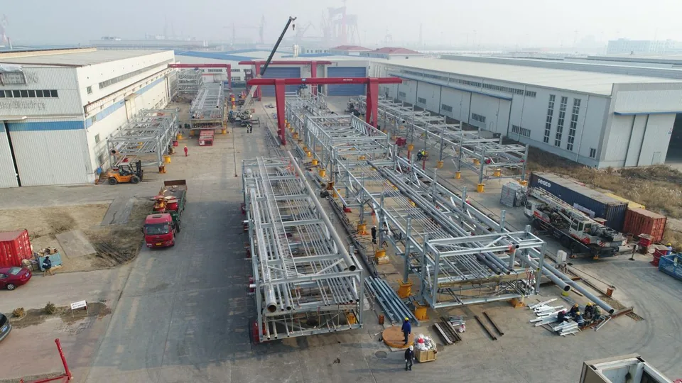 Aerial view of steel pipe rack modules laid out in the fabrication yard